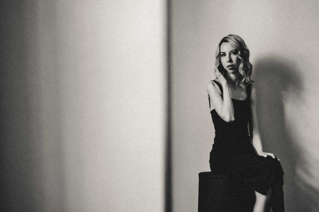 Woman gazing into natural light during an editorial boudoir session in Vacaville, California.