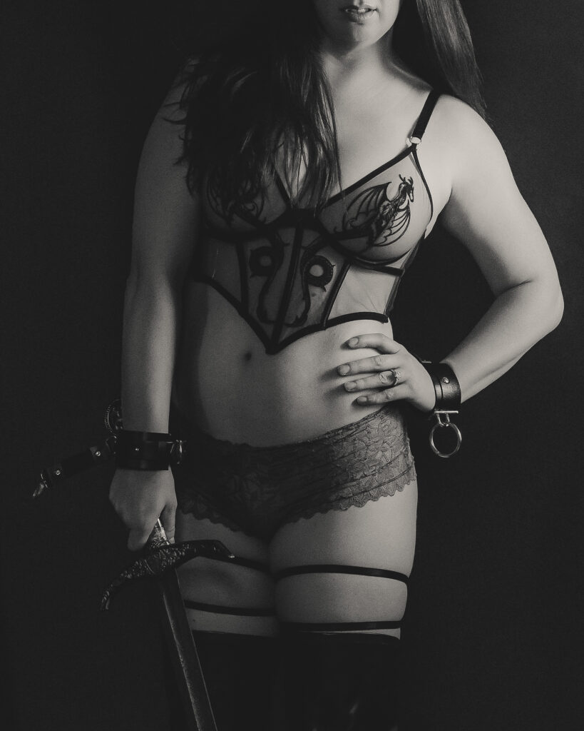 Editorial fantasy portrait featuring dark romance styling and cinematic studio lighting.