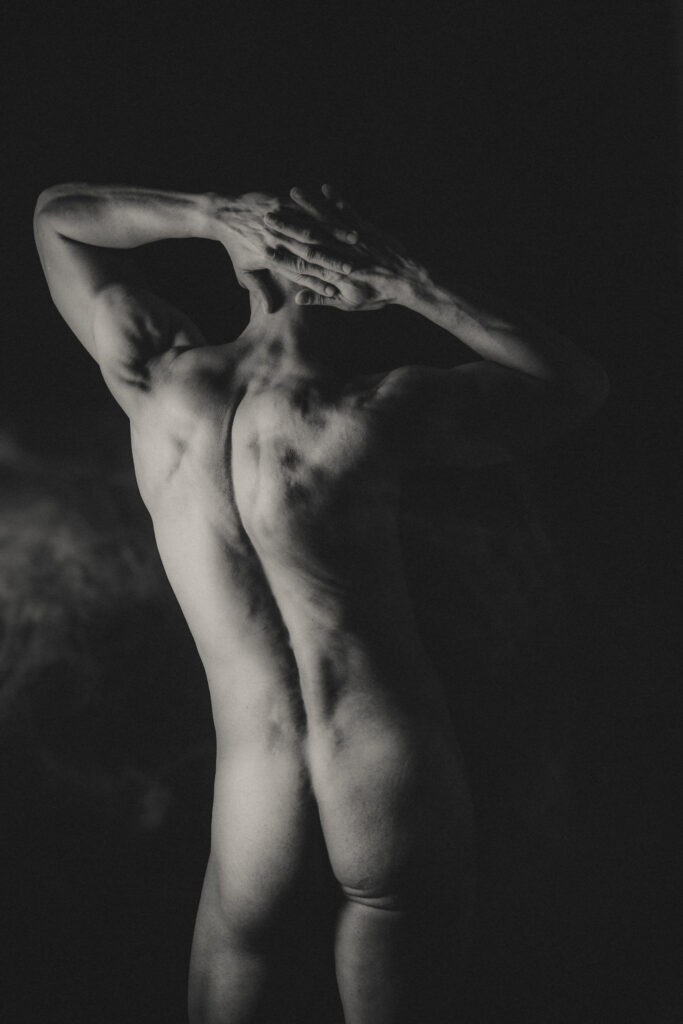 Editorial, fine art, male nude boudoir, studio lighting.